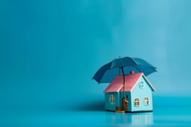 Bild på hus med paraply över